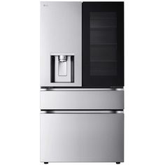 a silver refrigerator freezer sitting next to a glass door oven on top of a white wall