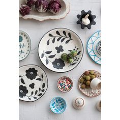 plates and bowls are arranged on the table