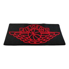 a black and red door mat with the word air jordan on it