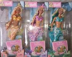 three barbie dolls are shown in their packaging