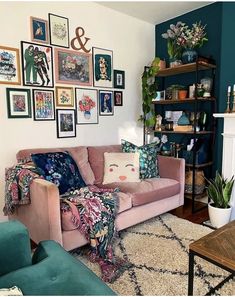 a living room filled with furniture and lots of pictures on the wall above it's fireplace