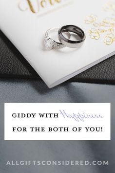 two wedding rings sitting on top of a card with the words, giddy with gorgeous for