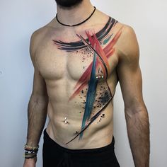 a man with tattoos on his chest