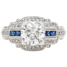 an antique style diamond and blue sapphire ring