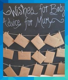 a chalkboard with notes pinned to it and the words wishes for baby advice for mums