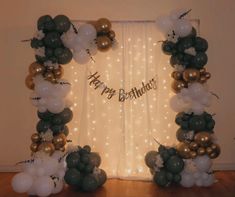 an arch made out of balloons with the words happy birthday on it