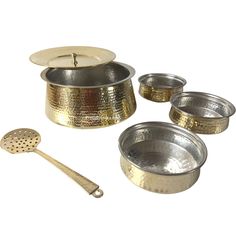 a set of four metal pots and spoons