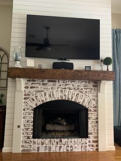 a fireplace with a flat screen tv above it