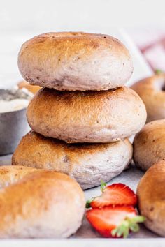 several bagels stacked on top of each other with strawberries