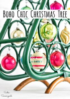 a christmas tree with ornaments hanging from it's sides and the words boho chic christmas tree