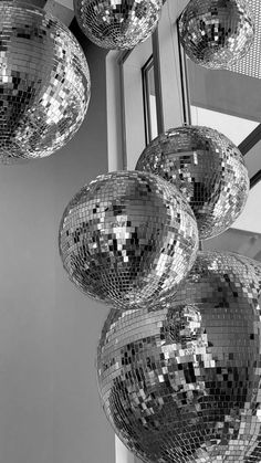 several disco balls hanging from the ceiling