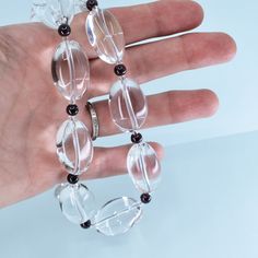 This is a classic design of mine from the turn of the century that I have re-imagined. Made from natural crystal quartz nuggets that are tumbled and polished to create smooth, touchable treasures. These clear quartz stones are of the highest quality and contain no notable inclusions or imperfections, mined in Brazil. Between each quartz is a deep red garnet. I found these top quality crystal quartz stones from one of my favorite suppliers at the Tucson Gem Show earlier this year and decided to c Elegant Clear Crystal Necklace With Faceted Beads, Elegant Clear Gemstone Beads Jewelry, Elegant Clear Crystal Round Bead Necklaces, Elegant Clear Crystal Necklaces With Round Beads, Elegant Clear Crystal Necklace With Round Beads, Elegant Quartz Round Beads Jewelry, Elegant Quartz Crystal Necklace For Healing, Elegant Glass Gemstone Bead Necklace, Elegant Quartz Beaded Jewelry