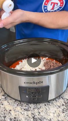 the crock pot is being used to make food