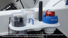 there is a drink holder attached to the side of a boat's front end