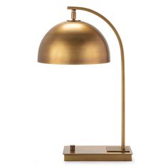 a brass colored lamp on a white background