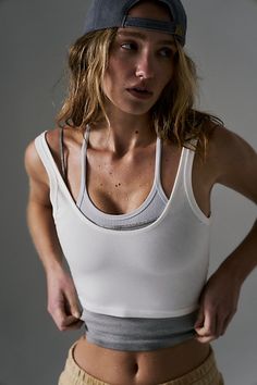 Hit up hot yoga in these sleek and sultry tank featured in a ribbed, second-skin design with a scoop neck and low back. * Moves-with-you-stretch * Fixed wide straps * Cropped silhouette | Hot Shot Crop Top by FP Movement at Free People, White, XS Stylish Workout Clothes, Sports Fashion Editorial, Athletic Wear Womens, Stylish Activewear, Free People Activewear, Yoga Tank Tops, Performance Leggings, Hot Shots, Crop Top Outfits