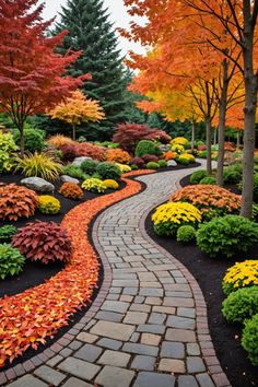 a pathway that is surrounded by trees and flowers in the fall season with leaves on it