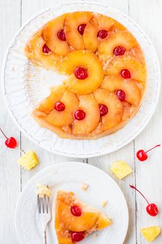 a pineapple upside down cake on a white plate with a fork next to it