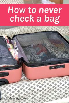 two pink suitcases sitting on top of a bed with the words never check a bag here's how