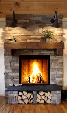 a fire place with logs in it