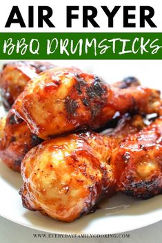 air fryer bbq drumsticks on a white plate with text overlay