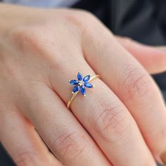 💎Add a touch of elegance to your jewelry collection with this stunning 14K Gold Sapphire Flower Ring. The intricate design features a dazzling Diamond Statement Ring centerpiece surrounded by beautiful Marquise Blue Gemstones. This Unique Ring for Women is the perfect September Birthstone accessory and makes a meaningful Birthday Gift that will be cherished for years to come. 💎We can make our product on the list in the colored stones you want. Feel free to send us a message so we can check. 💎 Blue Flower Rings For Formal Occasions, Fine Jewelry Sapphire Flower, Sapphire Flower Jewelry In Fine Style, Elegant Blue Flower Ring As Gift, Fine Jewelry Flower-shaped Birthstone Promise Ring, Fine Jewelry Flower Ring With Accent Stones, Fine Jewelry Floral Rings With Accent Stones, Flower Shaped Sapphire Jewelry Gift, Blue Flower Shaped Gemstone Ring