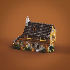 a house made out of legos on a brown background