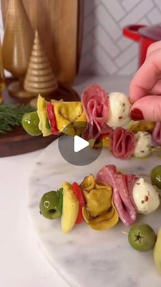 Delish on Instagram: "A bite-sized appetizer that’s sure to liven up any New Year’s Eve party 🤤

Make these Antipasto Tortellini Bites using the link in bio.

🎥 @thegarnishedpalate @itsashrev"