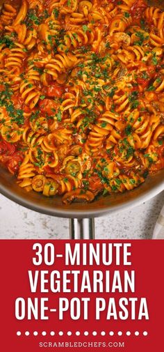 a large pot filled with pasta covered in sauce and parsley on top of it