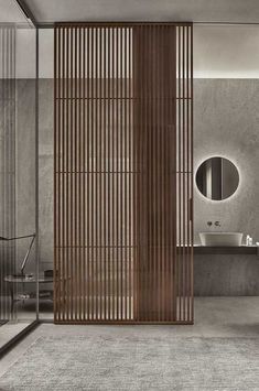 a modern bathroom with wooden slats on the wall