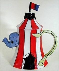 a red and white striped coffee pot with an elephant on it's side, holding a flag