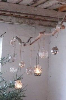 some glass balls hanging from a ceiling in a room