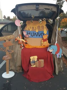 the trunk of a car is decorated with winnie the pooh signs and other decorations