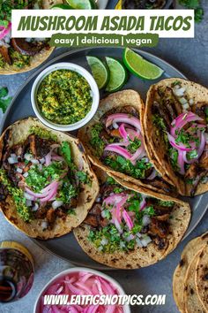 three tacos on a plate with salsa, onions and cilantro