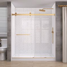 a bathroom with a walk in shower next to a white toilet and a gold handle