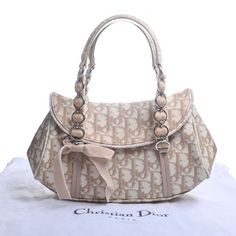 Christian Dior Romantic Trotter Leather Handbag Beige LadiesBrand: Christian DiorGender: WomenLine: RomantiqueColor: BeigeHardware color: SilverMaterial: Leather, PVCComes with: Dust bagSize (HxWxD): 15cm x 28cm x 7cm / 5.9'' x 11.02'' x 2.75''Delivery 5-8 or 10-15 working days Please note that during high season and Sale period, delivery times may be affected We accept payment with a Credit card, Debit card, or PayPal. Christian Dior Handbags, Girly Bags, Fancy Bags, Dior Handbags, Trotter, Pretty Bags, Mode Inspo, Cute Bags, Silver Hardware