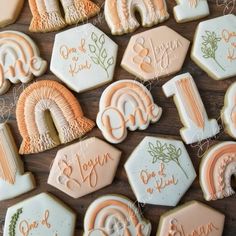 some cookies are decorated with different designs and words on them, including the number one