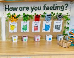 a bulletin board with pictures of different animals and words that say how are you feeling?