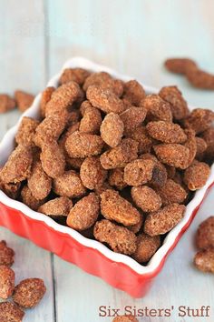 a bowl filled with cinnamon almonds sitting on top of a table