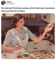 a woman in an apron is cooking cookies