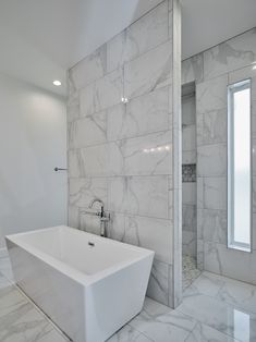 Standing tub in front of a full tile wall with a walk-in shower behind it. Plunge Tub Bathroom, Shower Behind Wall Walk In, Shower Behind Tub Wall, Bathtub With Shower Behind, Bathtub In Front Of Shower Master Bath, Shower Behind Bathtub, Master Bath Shower Behind Tub, Tub In Front Of Walk In Shower Wall, Walk In Shower No Door With Free Standing Tub