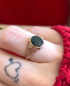 12K rose gold vintage bloodstone carved signet ring. Size 5.25 Gem Steady estate jewelry is sold as-is.  If you are not satisfied with your purchase please message us immediately. Your Gem Steady estate purchase may be returned or exchanged minus shipping costs within 7 days of delivery. Gothic Signet Ring, Streetstyle Hairstyle, Bloodstone Jewelry, Gem Gem, Bloodstone Ring, Witch Rings, Diy Leather Bracelet, Smoky Quartz Ring, Witch Jewelry