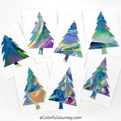 six christmas trees made with acrylic paint