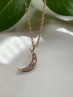 "Dainty Diamond Moon Necklace Pendant in 14k rose gold. This necklace is perfect by itself or or layered. You can wear it day or night. This necklace is versatile and perfect as a gift. Effortlessly trendy and beautiful! Metal14k Rose gold Pure gold / Finish.... polish NecklaceHandmade in USA Diamond weight0.10CT G - VS1 quality *14k rose gold chain included * Chain sizes Available.. 16\", 18\" , 20 inches long" Elegant 14k Gold Moon Charm Necklace, Elegant Crescent Charm Necklace With Delicate Chain, Rose Gold Moon Charm Jewelry For Wedding, Rose Gold Jewelry With Moon Charm For Wedding, Rose Gold Moon Charm Wedding Jewelry, Elegant Moon-shaped Necklace With Delicate Chain, Minimalist 14k Rose Gold Necklace, 14k Rose Gold Necklaces For Gifts, Rose Gold Crescent Necklace With Moon Charm