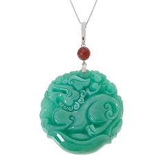 Kwan Collections Carved Jade Dragon Pendant with 18" Chain  Celebrate the Chinese Year of the Dragon with this expertly-carved green jade dragon pendant. Dragons represent strength and good luck in many eastern cultures. This pretty piece features a faceted red jade accent, silver enhancer bail and includes an 18" chain necklace.        Pendant approx. 3-1/8"L x 2"W     Chain approx. 18"L x 1/16"W with 2" extender     Stamped .925     Enhancer bail     Round green jade pendant has carved dragon design     Carved piece topped with round, faceted red jade bead accent     Comes with rope chain necklace; spring ring clasp   Stone Information       All sizes and weights approximate     Color-Enhanced Green Jade - Round carved (50mm)     Color-Enhanced Red Jade - Faceted bead (8mm) Traditional Engraved Jade Necklace, Traditional Jade Necklace With Round Pendant, Traditional Jade Medallion Jewelry, Green Carved Amulet Necklace, Jade Round Large Pendant Jewelry, Green Engraved Medallion Necklaces, Green Engraved Medallion Necklace, Engraved Green Medallion Necklace, Engraved Jade Amulet Jewelry