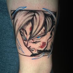 a man's leg with a tattoo on it that has an image of a demon