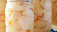 two jars filled with sliced bananas on top of a table