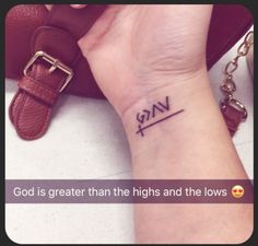 a wrist tattoo saying god is greater than the highs and the flows