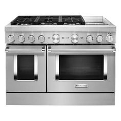 a stainless steel stove with two ovens on each side and four burners in the middle