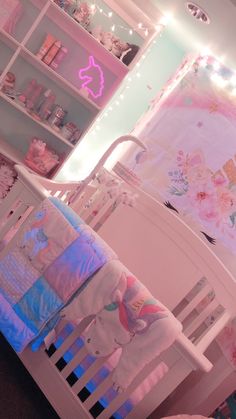 a baby's room is decorated in pink and blue